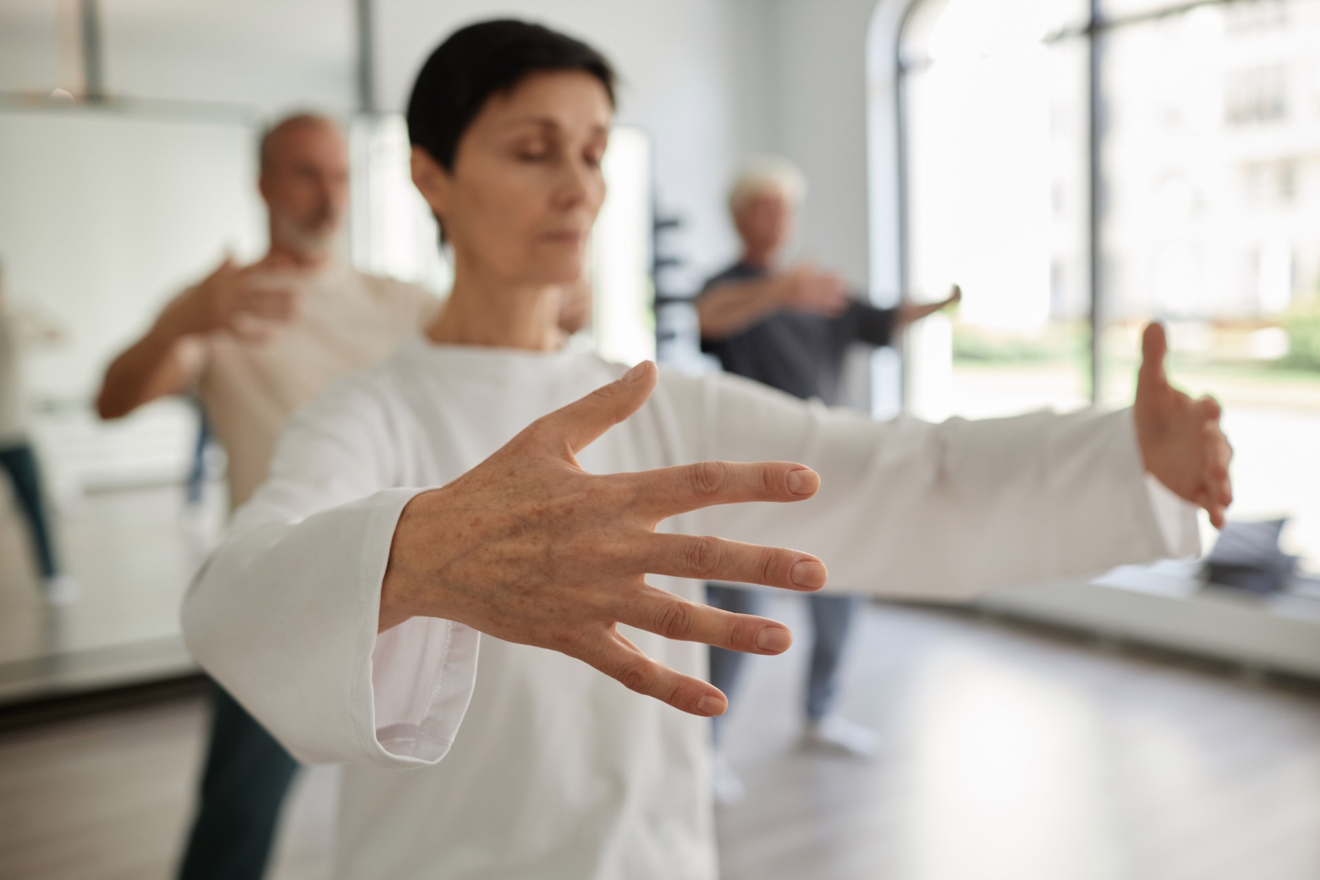 Senior Female Qigong Student Exercising