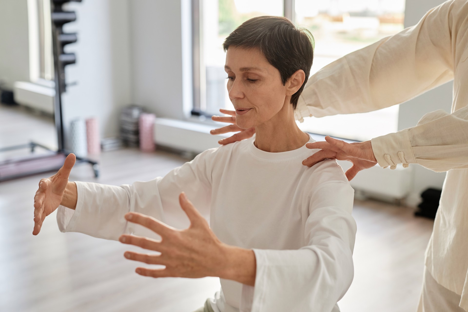 Focused Senior Lady Doing Yoga Breathing Exercise